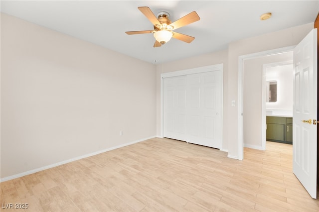 5009 Elm Grove Dr, Las Vegas, NV 89130 - unfurnished bedroom featuring a closet, baseboards, light wood-style floors, and ceiling fan