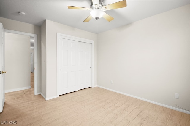 5009 Elm Grove Dr, Las Vegas, NV 89130 - unfurnished bedroom featuring light wood finished floors, baseboards, a closet, and ceiling fan