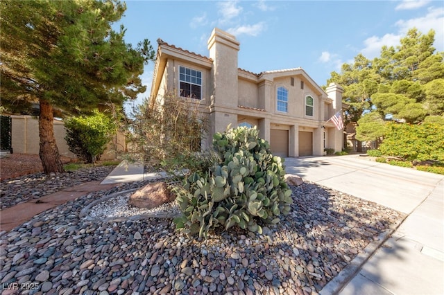 2834 Crystal Lantern Dr, Henderson, NV 89074 - mediterranean / spanish-style house with a chimney, stucco siding, a garage, concrete driveway, and a tiled roof