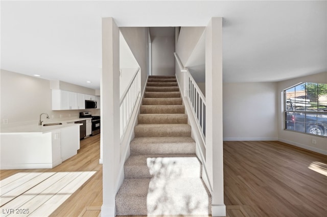 2834 Crystal Lantern Dr, Henderson, NV 89074 - staircase featuring wood finished floors, recessed lighting, and baseboards