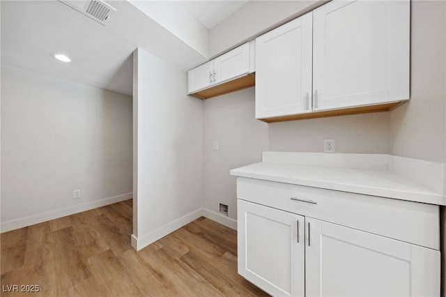 2834 Crystal Lantern Dr, Henderson, NV 89074 - interior space featuring light wood finished floors, white cabinetry, baseboards, light countertops, and recessed lighting
