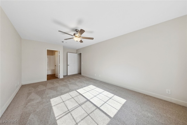 2834 Crystal Lantern Dr, Henderson, NV 89074 - unfurnished bedroom with light colored carpet, baseboards, a ceiling fan, and connected bathroom