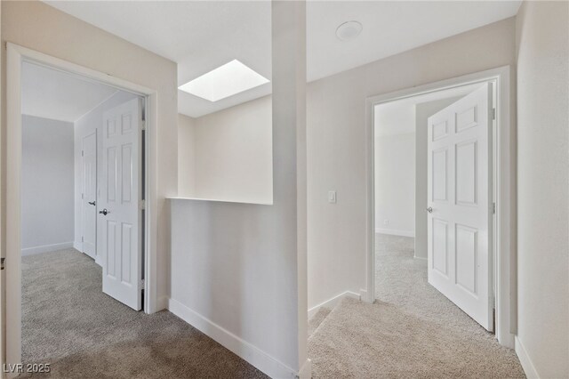 2834 Crystal Lantern Dr, Henderson, NV 89074 - corridor featuring carpet flooring, a skylight, and baseboards