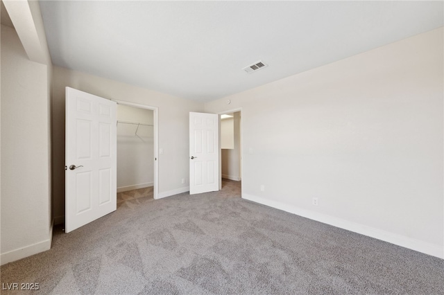2834 Crystal Lantern Dr, Henderson, NV 89074 - unfurnished bedroom with carpet floors, baseboards, and a walk in closet