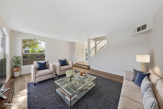 2834 Crystal Lantern Dr, Henderson, NV 89074 - living area with wood finished floors, baseboards, and stairs