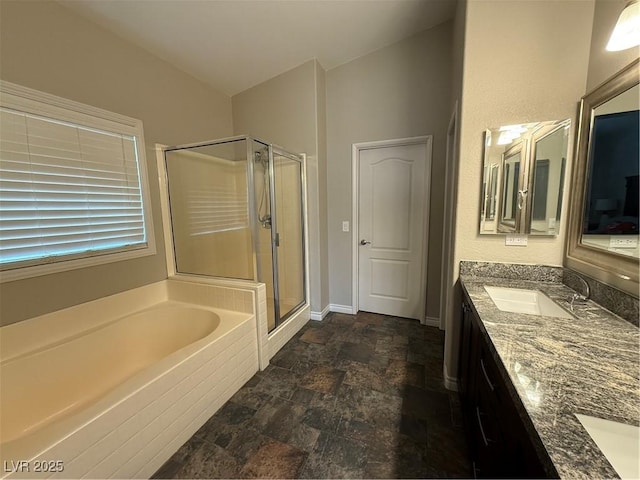5318 Rio Eldorado Ct, North Las Vegas, NV 89031 - full bath with a shower stall, a garden tub, stone finish floors, double vanity, and baseboards