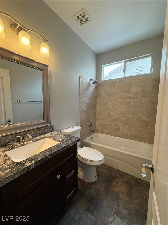 5318 Rio Eldorado Ct, North Las Vegas, NV 89031 - full bath with  shower combination, vanity, toilet, and stone finish flooring