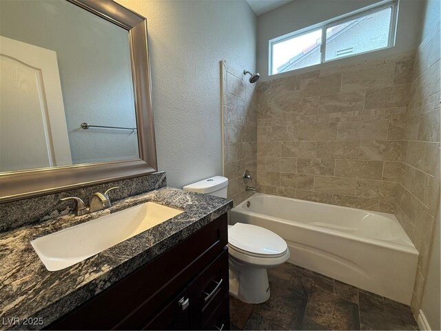 5318 Rio Eldorado Ct, North Las Vegas, NV 89031 - full bathroom with toilet, stone finish floors, bathtub / shower combination, and vanity