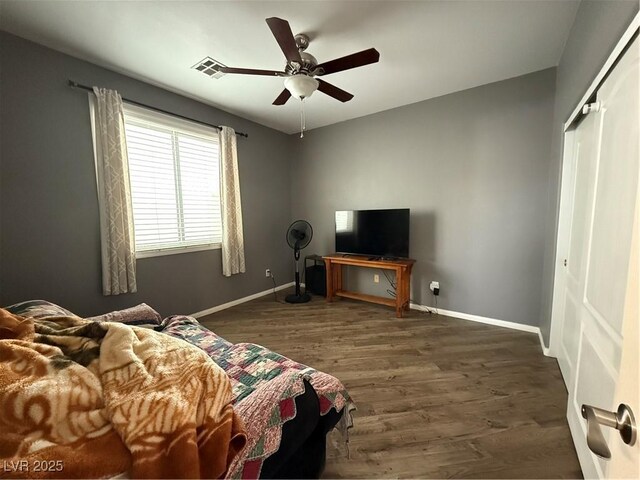 5318 Rio Eldorado Ct, North Las Vegas, NV 89031 - bedroom featuring wood finished floors, baseboards, a closet, and ceiling fan
