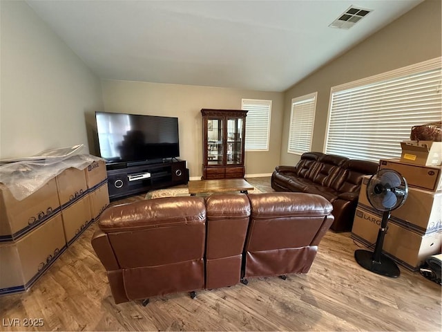 5318 Rio Eldorado Ct, North Las Vegas, NV 89031 - living room featuring vaulted ceiling and light wood finished floors