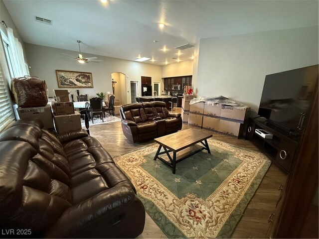5318 Rio Eldorado Ct, North Las Vegas, NV 89031 - living room with ceiling fan, wood finished floors, and arched walkways