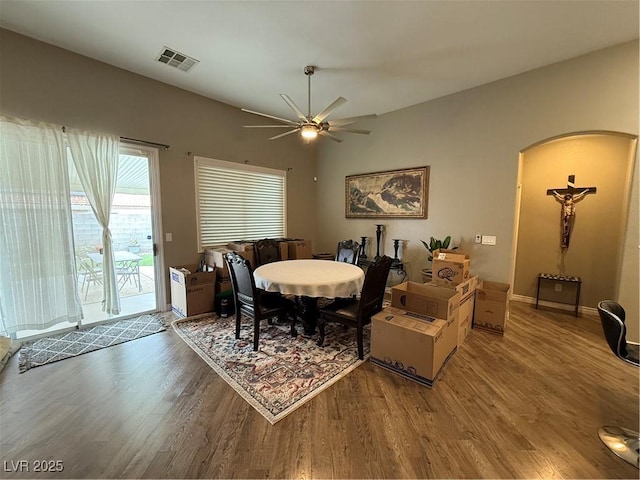 5318 Rio Eldorado Ct, North Las Vegas, NV 89031 - dining room with wood finished floors, arched walkways, and ceiling fan