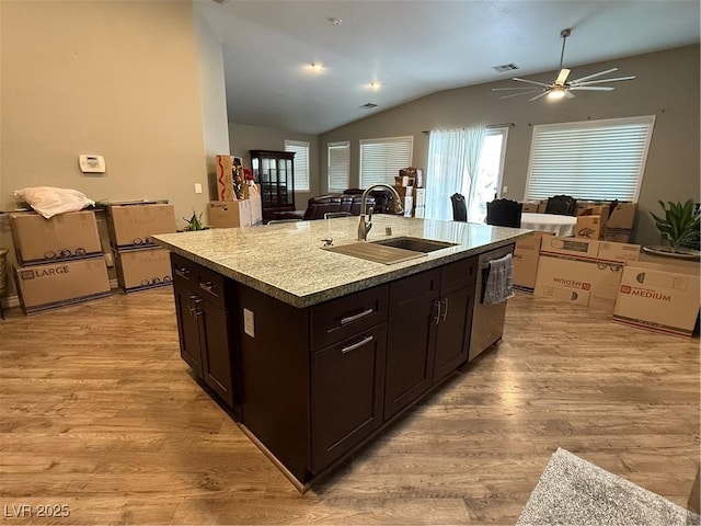 5318 Rio Eldorado Ct, North Las Vegas, NV 89031 - kitchen featuring a sink, stainless steel dishwasher, vaulted ceiling, light wood-style flooring, and a ceiling fan
