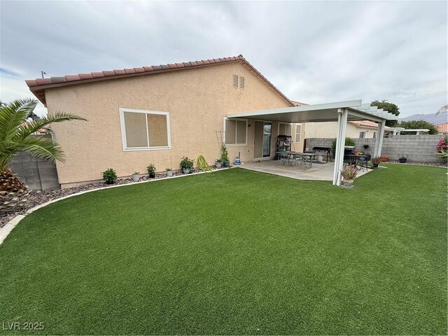 5318 Rio Eldorado Ct, North Las Vegas, NV 89031 - back of property featuring a patio area and stucco siding