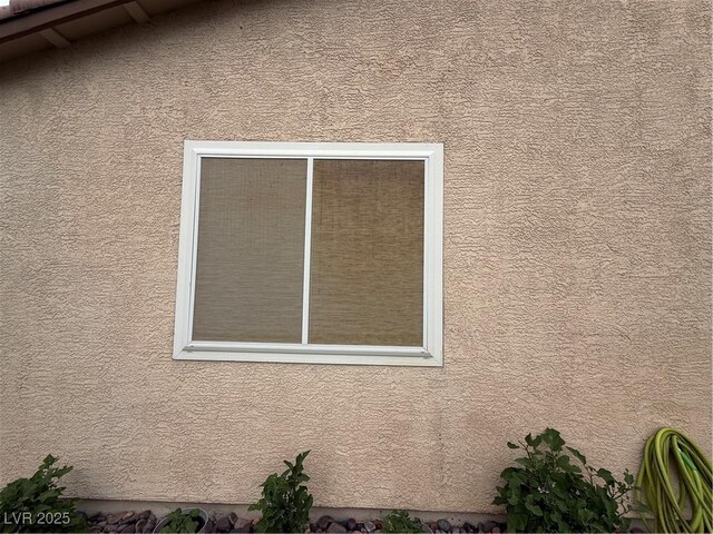 5318 Rio Eldorado Ct, North Las Vegas, NV 89031 - exterior view of stucco siding