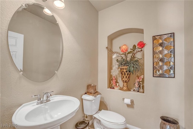6453 Mount Eden Ave, Las Vegas, NV 89139 - bathroom with a sink, toilet, and baseboards