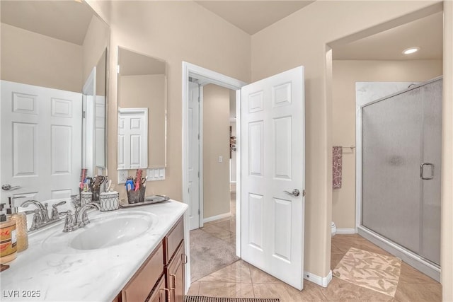 6453 Mount Eden Ave, Las Vegas, NV 89139 - bathroom with a stall shower, vanity, baseboards, toilet, and tile patterned flooring