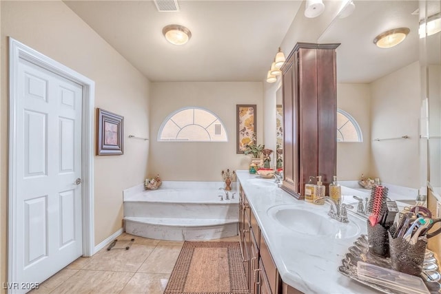 6453 Mount Eden Ave, Las Vegas, NV 89139 - full bath featuring a garden tub, double vanity, and baseboards