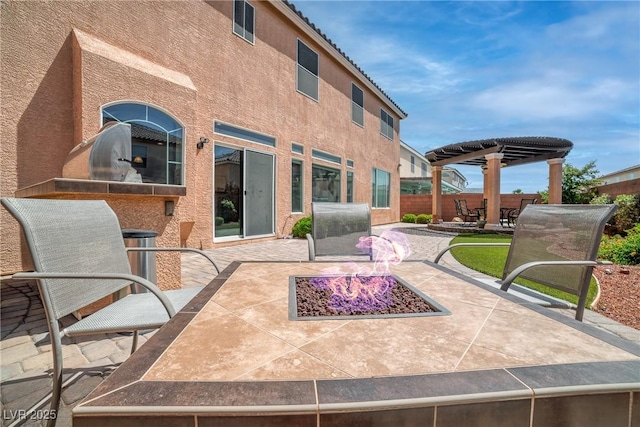 6453 Mount Eden Ave, Las Vegas, NV 89139 - view of patio with a fire pit and a pergola