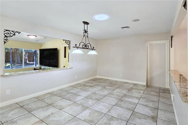 5159 N Monte Cristo Way, Las Vegas, NV 89149 - unfurnished dining area featuring light tile patterned floors and baseboards