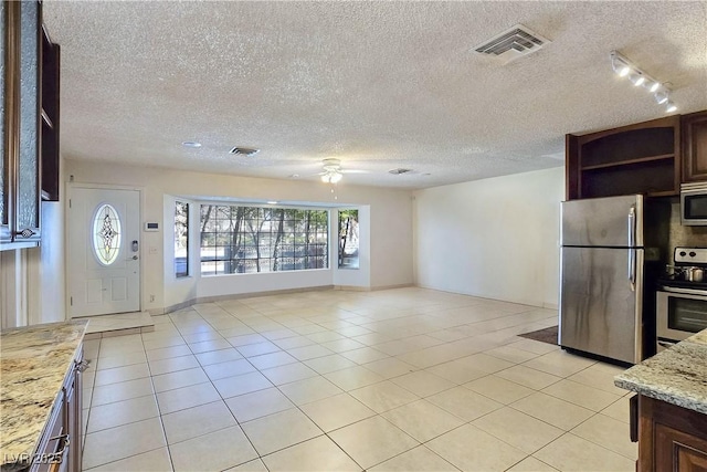 5159 N Monte Cristo Way, Las Vegas, NV 89149 - kitchen with appliances with stainless steel finishes, open shelves, a ceiling fan, rail lighting, and a textured ceiling