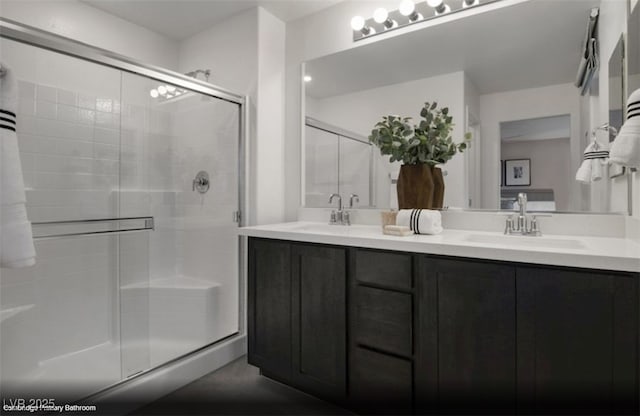 6698 Nimbus Ave Lot 17, Las Vegas, NV 89130 - bathroom featuring a stall shower and double vanity