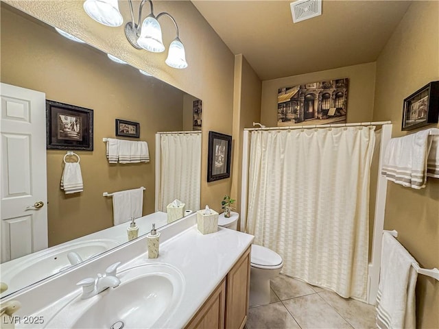 full bathroom featuring tile patterned floors, vanity, and toilet