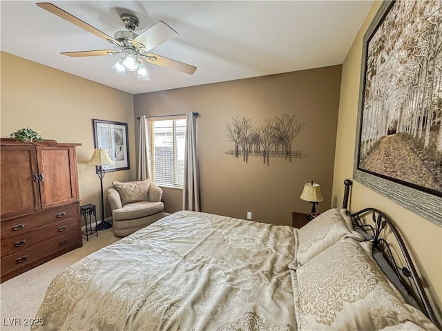 bedroom featuring light colored carpet and ceiling fan