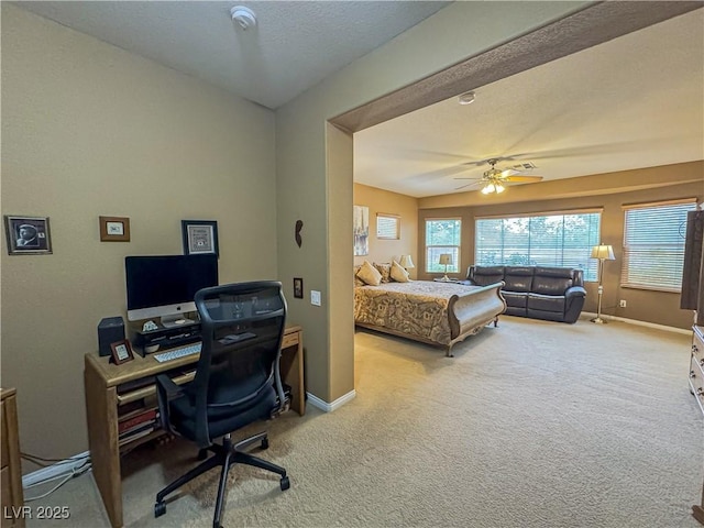 bedroom featuring carpet flooring, a desk, baseboards, and ceiling fan