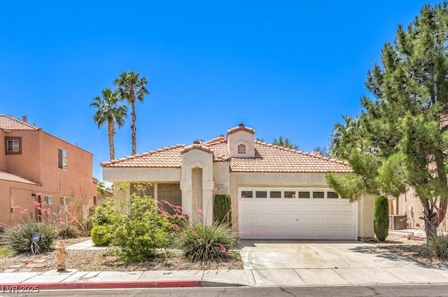 2753 Port Of Call Dr, Las Vegas, NV 89128 - mediterranean / spanish home featuring a garage, a tile roof, stucco siding, concrete driveway, and a chimney