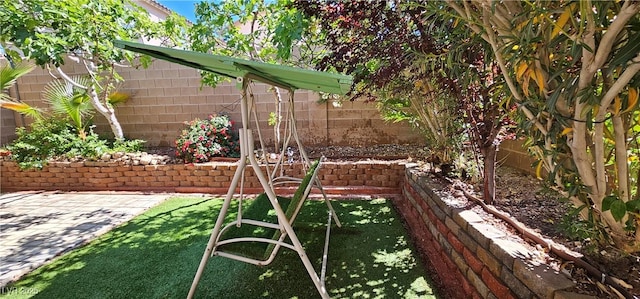 fenced backyard featuring a patio