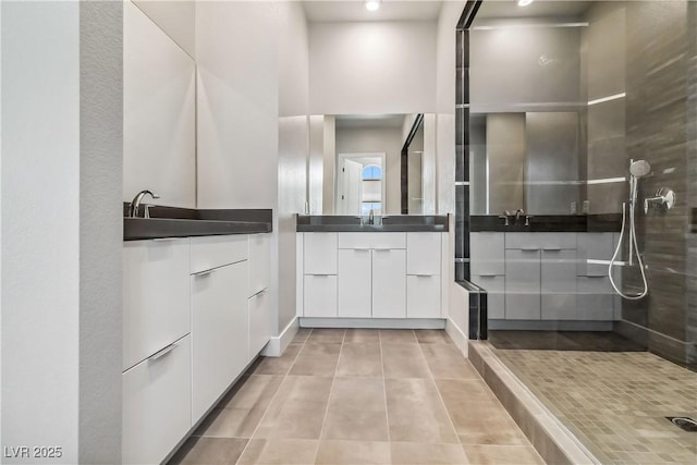 9125 Las Manaitas Ave Unit 302, Las Vegas, NV 89144 - bathroom with two vanities, tiled shower, tile patterned floors, and recessed lighting