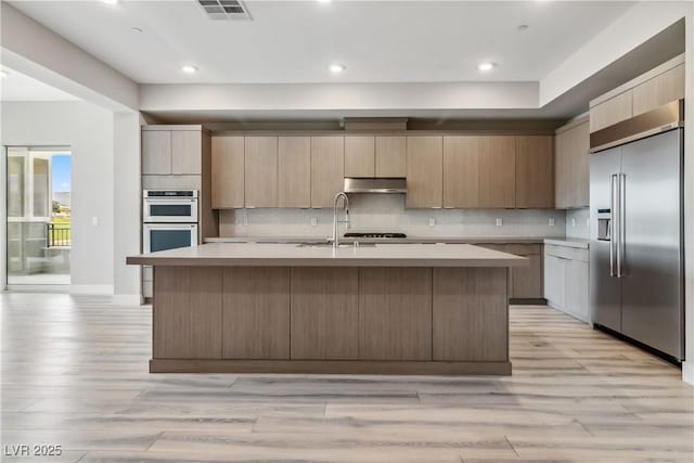 9125 Las Manaitas Ave Unit 302, Las Vegas, NV 89144 - kitchen featuring built in fridge, under cabinet range hood, light countertops, double oven, and recessed lighting