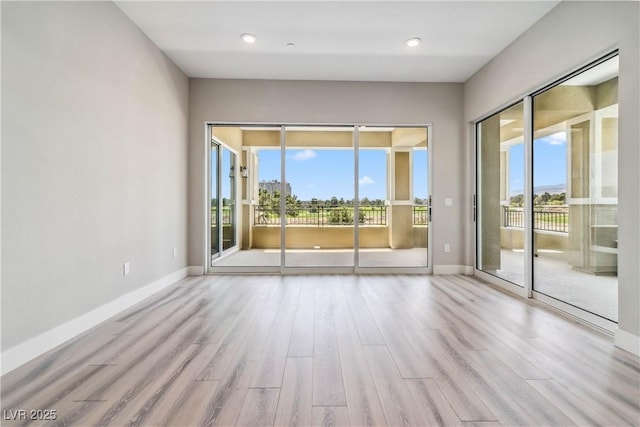 9125 Las Manaitas Ave Unit 302, Las Vegas, NV 89144 - empty room with wood finished floors, baseboards, and recessed lighting