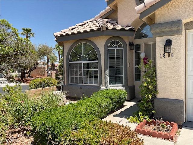 1800 Quail Point Ct, Las Vegas, NV 89117 - view of property exterior featuring a tiled roof and stucco siding