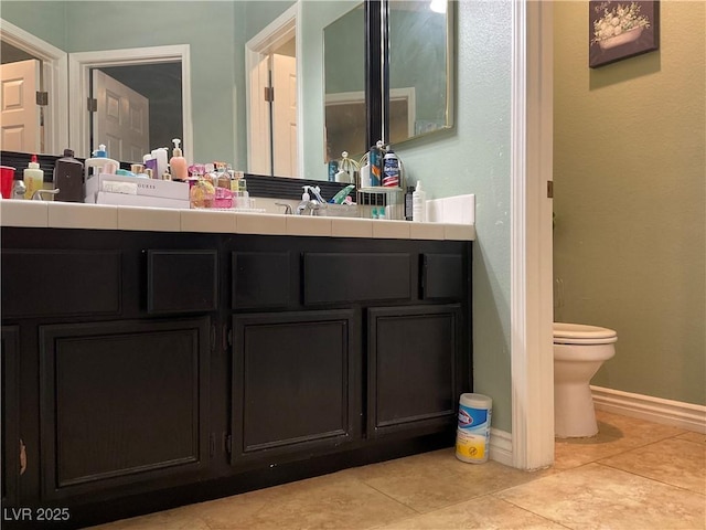 1800 Quail Point Ct, Las Vegas, NV 89117 - bathroom with toilet, vanity, tile patterned flooring, and baseboards