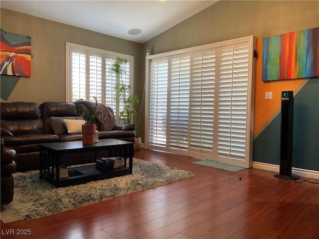 1800 Quail Point Ct, Las Vegas, NV 89117 - living area with lofted ceiling, wood finished floors, and baseboards