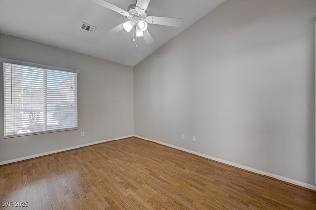 472 Staghorn Pass Ave, Las Vegas, NV 89183 - spare room with light wood-style flooring, vaulted ceiling, baseboards, and ceiling fan