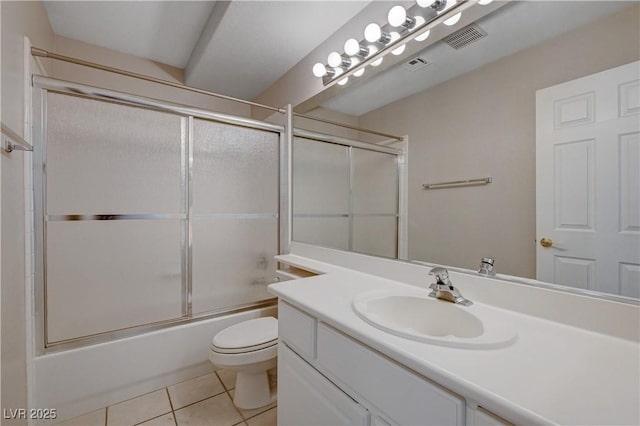 472 Staghorn Pass Ave, Las Vegas, NV 89183 - bathroom featuring tile patterned floors, toilet, vanity, and enclosed tub / shower combo