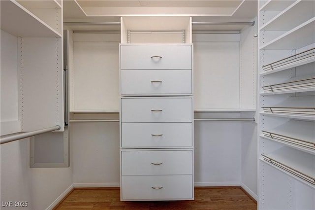 472 Staghorn Pass Ave, Las Vegas, NV 89183 - walk in closet featuring wood finished floors