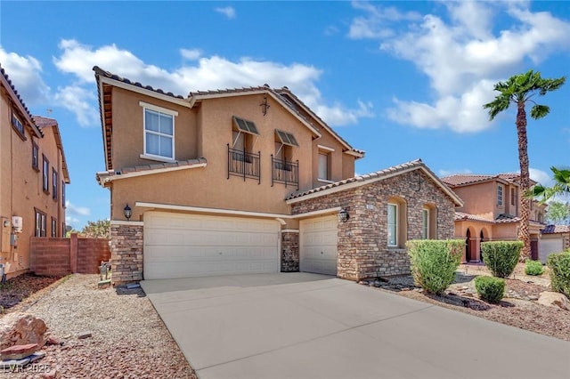 3217 Bonassola Ave, North Las Vegas, NV 89031 - mediterranean / spanish-style home featuring stone siding, stucco siding, a tile roof, a garage, and driveway