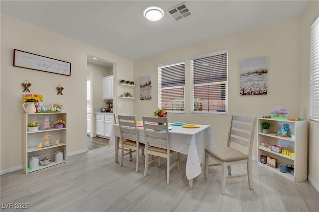 3217 Bonassola Ave, North Las Vegas, NV 89031 - dining area featuring baseboards and light wood finished floors
