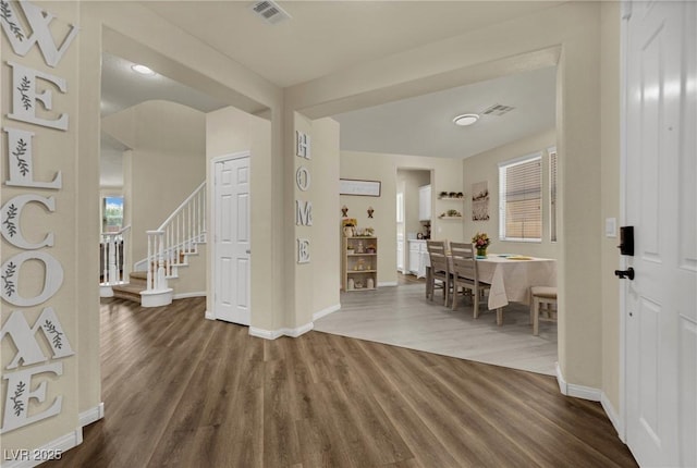 3217 Bonassola Ave, North Las Vegas, NV 89031 - foyer entrance with dark wood-style floors, baseboards, and stairs