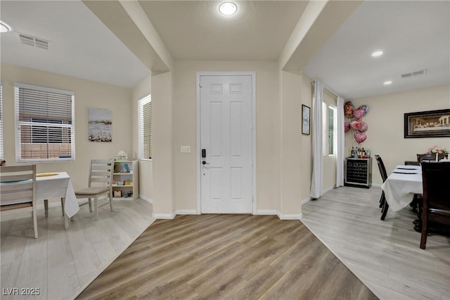3217 Bonassola Ave, North Las Vegas, NV 89031 - entrance foyer with light wood finished floors, healthy amount of natural light, baseboards, and recessed lighting