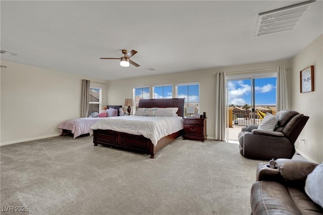 3217 Bonassola Ave, North Las Vegas, NV 89031 - bedroom featuring access to exterior, baseboards, light colored carpet, and ceiling fan