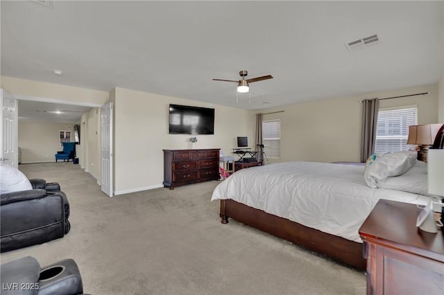 3217 Bonassola Ave, North Las Vegas, NV 89031 - bedroom featuring light colored carpet, baseboards, and ceiling fan