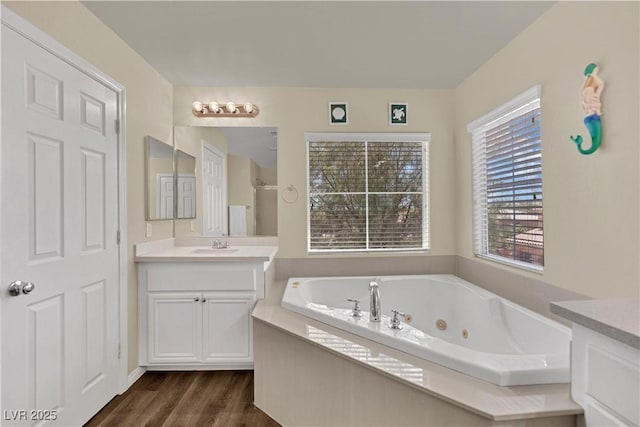 3217 Bonassola Ave, North Las Vegas, NV 89031 - full bathroom featuring vanity, a jetted tub, wood finished floors, and a walk in shower
