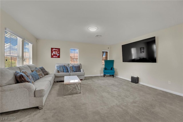 3217 Bonassola Ave, North Las Vegas, NV 89031 - carpeted living room with plenty of natural light and baseboards