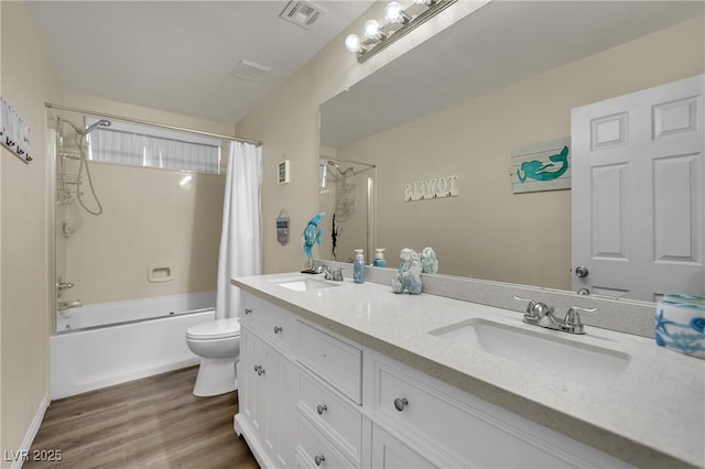 3217 Bonassola Ave, North Las Vegas, NV 89031 - bathroom with toilet, shower / bath combination with curtain, double vanity, and wood finished floors