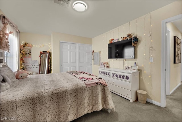 3217 Bonassola Ave, North Las Vegas, NV 89031 - bedroom with carpet floors, a closet, and baseboards